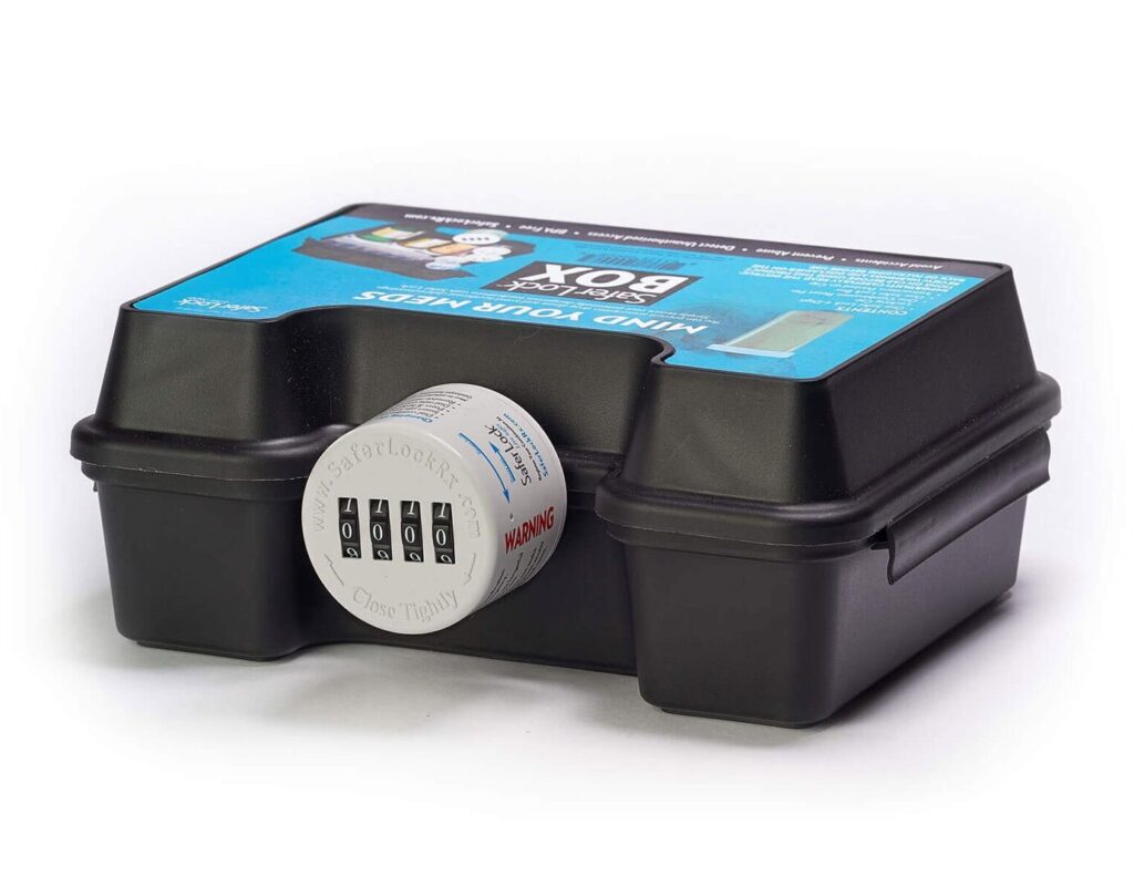 Photo of a black medication lock box with a combination lock and a blue label